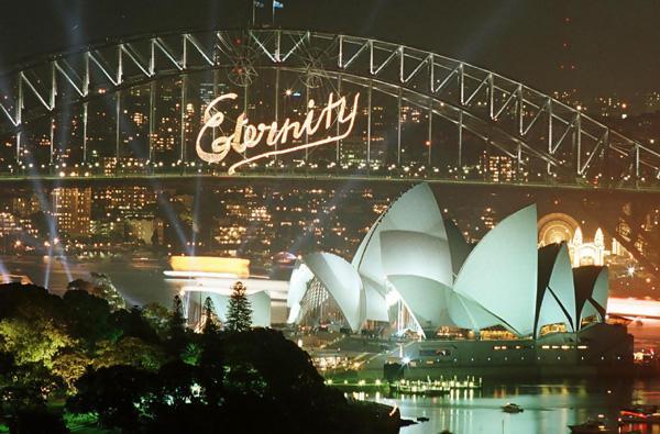 Arthur Stace's "Eternity" lit up Sydney's Habour Bridge after a spectacular fireworks display welcomed in the year 2000 to Sydney January 1.